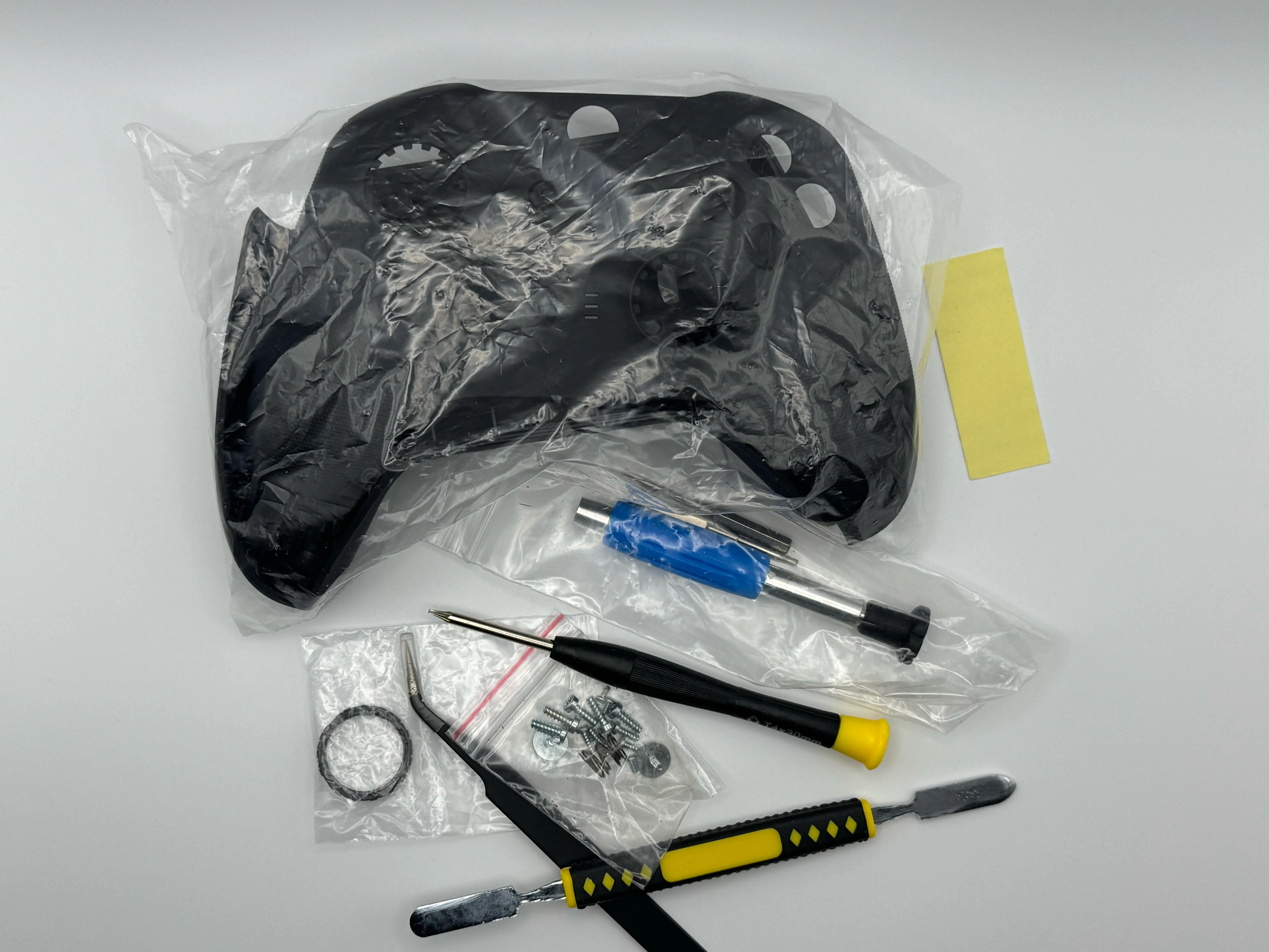 Replacement rear shell and repair tools used for the controller repair